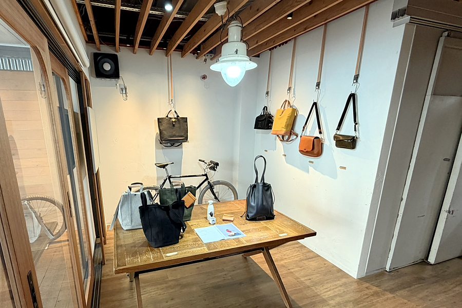 The table and bags on the wall